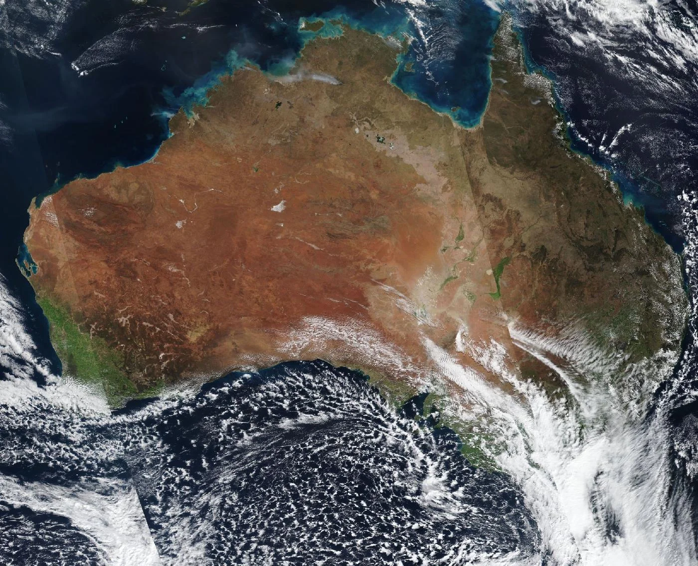 Satellite image of Australia from space, showing the continent, the Outback, and the Great Barrier Reef