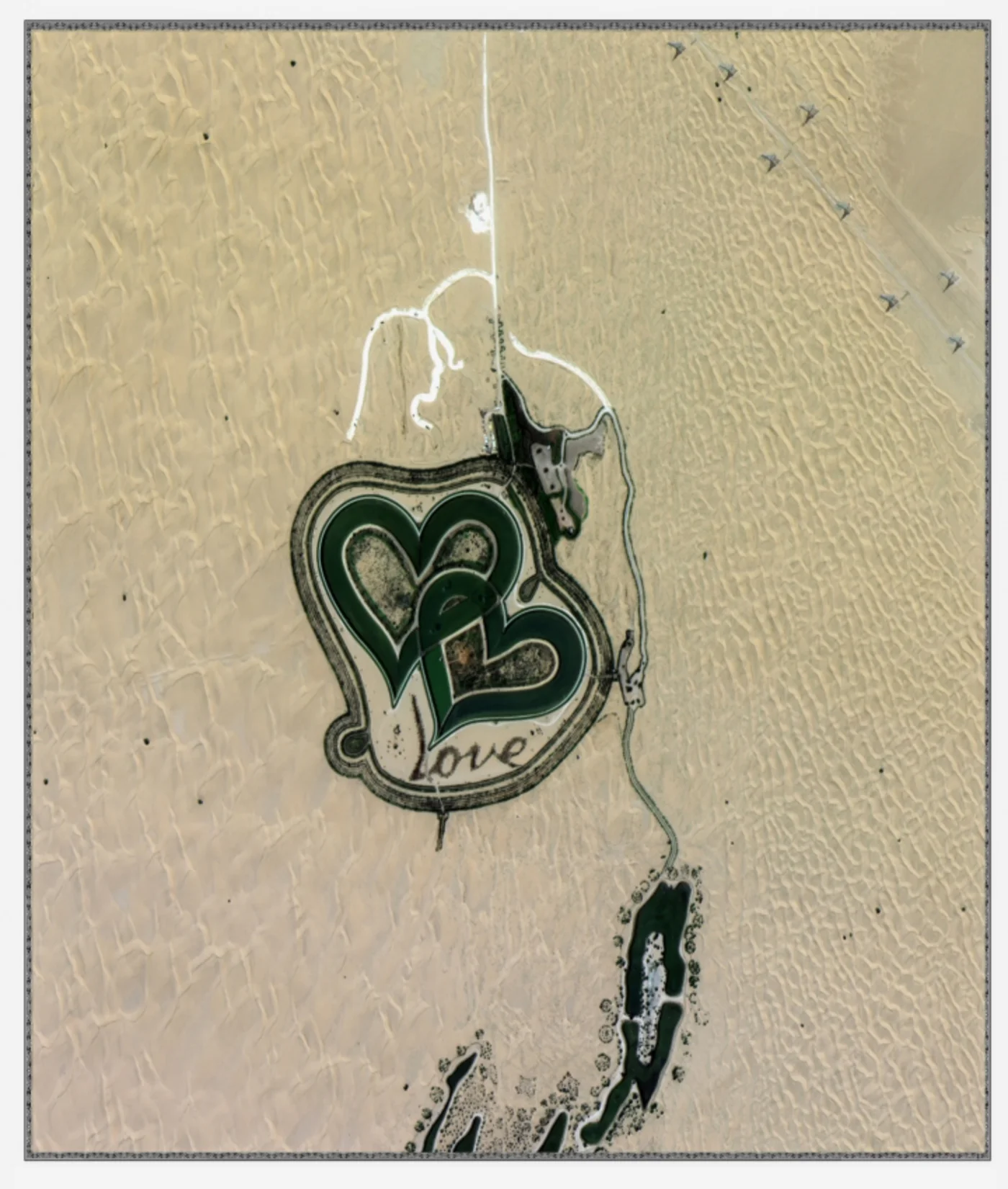 Satellite image of the heart-shaped Love Lake in the Al Qudra desert, Dubai