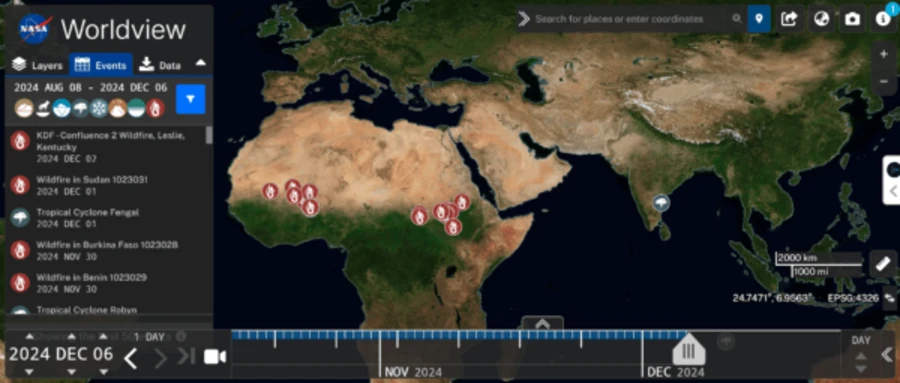 NASA Worldview interface showing a global satellite map with wildfire event markers across Africa and the Middle East