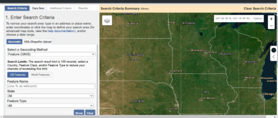 USGS EarthExplorer interface showing search criteria panel and a satellite map of the central United States