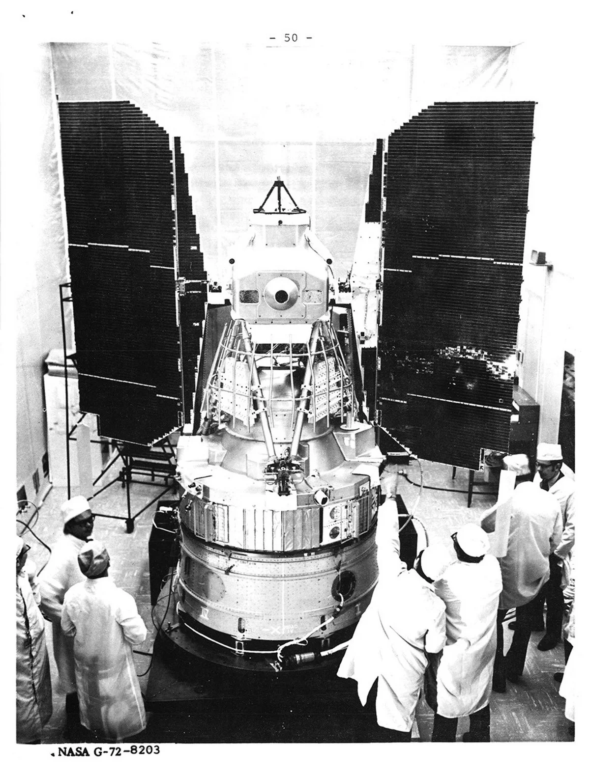 A real photo of a satellite, the Landsat 1 (ERTS-1) spacecraft with its solar panels deployed, undergoing prelaunch testing at a GE facility in 1972