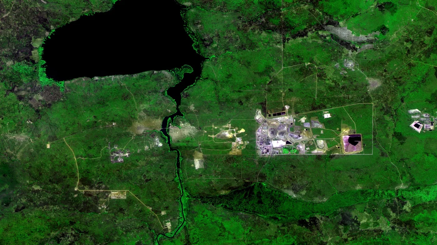 False-color CBERS-4 satellite image of the Mutanda open-pit copper and cobalt mine near Kolwezi in the Democratic Republic of the Congo, with tailings ponds visible in magenta beside the pit