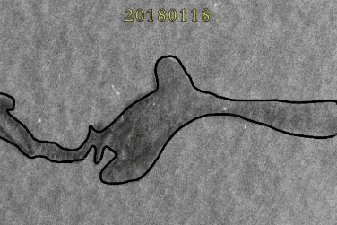 SAR satellite image with an automatically extracted waterline boundary outlined against surrounding terrain