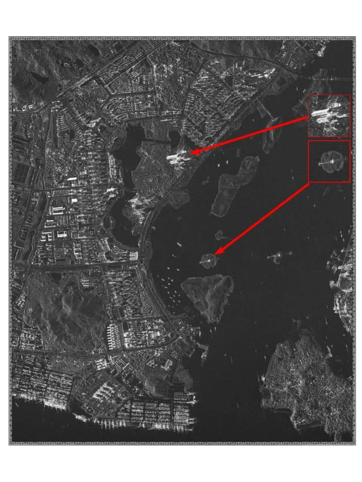 Annotated SAR satellite image highlighting automatically detected ships in open water for maritime monitoring