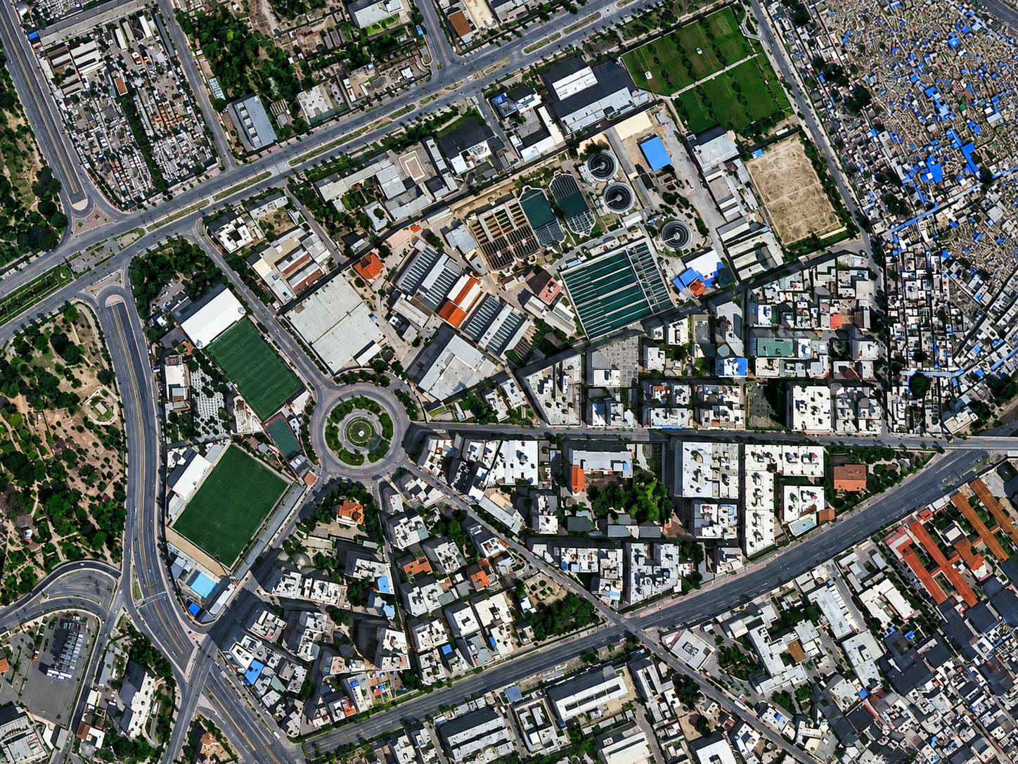 High-resolution satellite image of a residential district and roundabout in Alexandria, Egypt