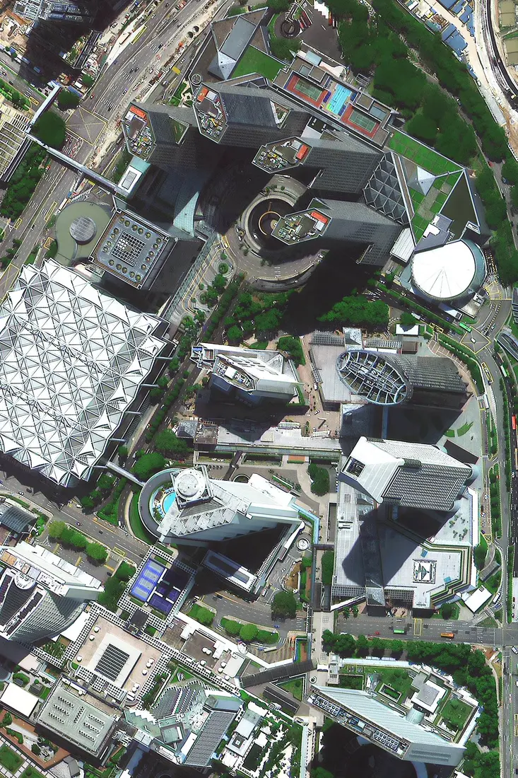 30cm super high resolution satellite image of a dense downtown district in Singapore showing individual building rooftops
