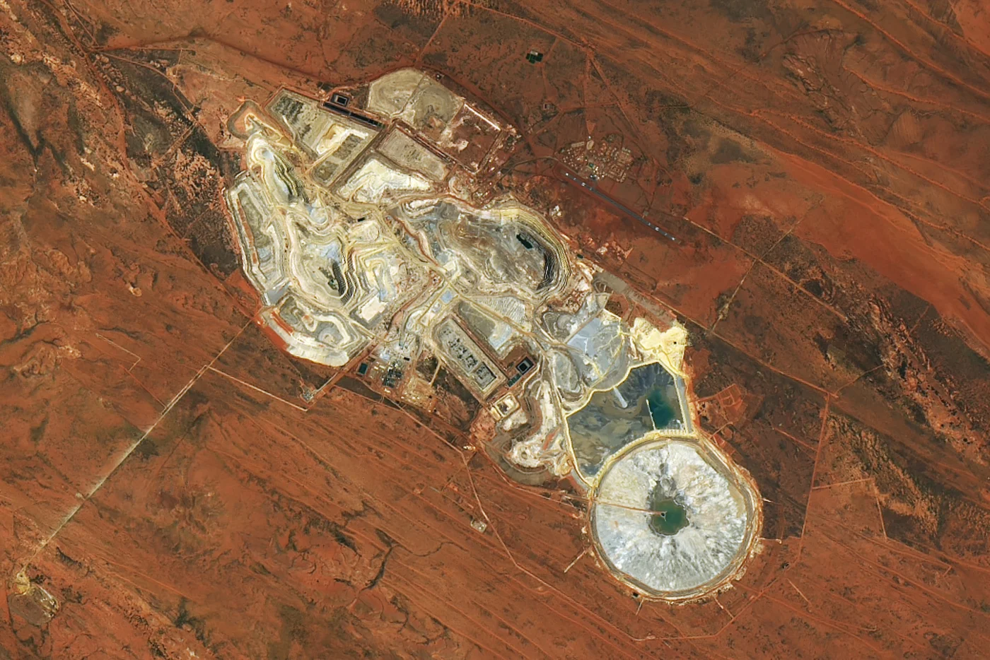 High-resolution satellite image of the Telfer gold and copper mine in Western Australia showing open pits and tailings ponds